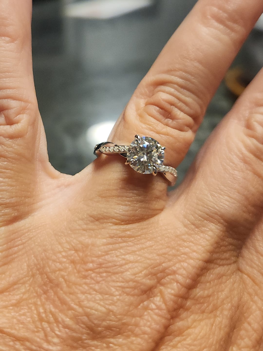Customer photo review of Round Moissanite Infinity Petite Twisted Vine Engagement Ring