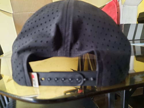 Customer's Big Flat Bill Structured Watersport Hat showing the black perforated material and adjustable snapback closure