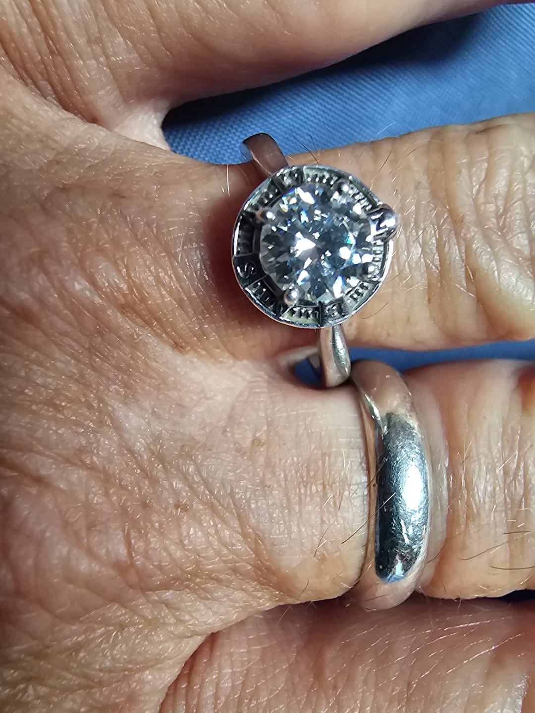 Customer photo review of North Star Halo Compass Solitaire Moissanite Engagement Ring