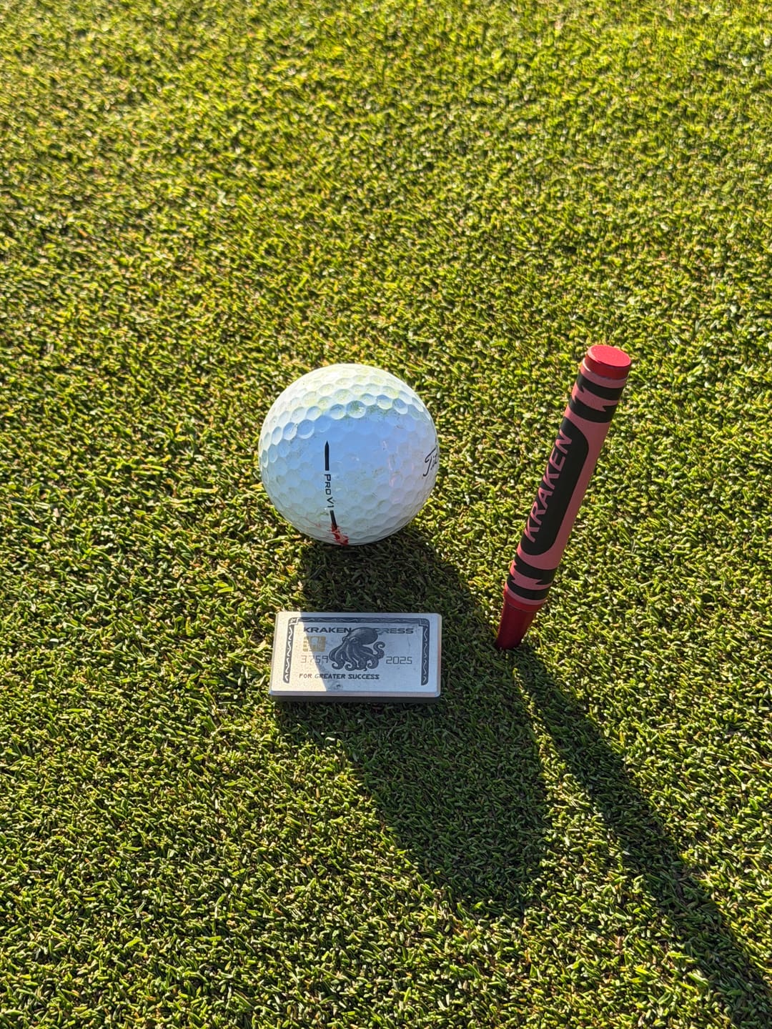 Customer photo review of The Silver Kraken Express Ball Marker | Kraken Titanium Golf Ball Marker