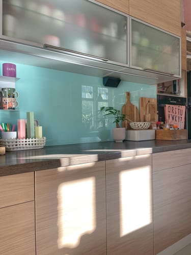 Customer's kitchen cabinets updated with Tropea Oak kontaktplast, showing the textured oak wood pattern.