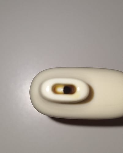 Customer's close-up view of the THC-A Vape mouthpiece showing visible brown residue inside the opening.