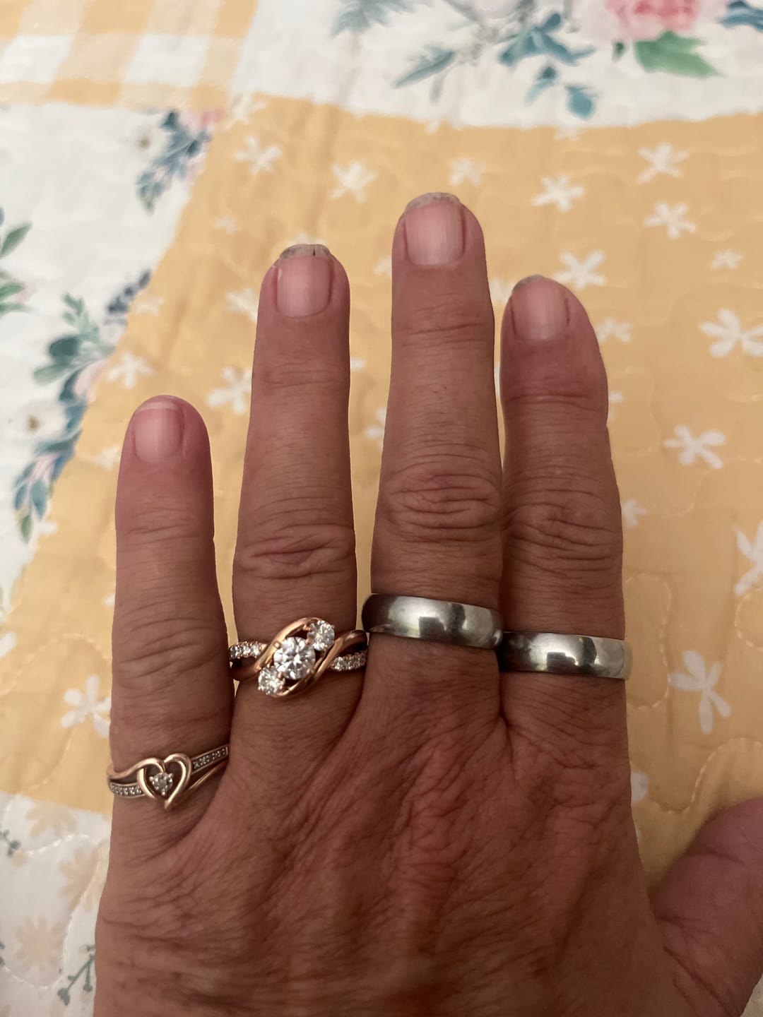 Customer photo review of Swirl Three Stone Moissanite Twisted Pave Gold Engagement Ring