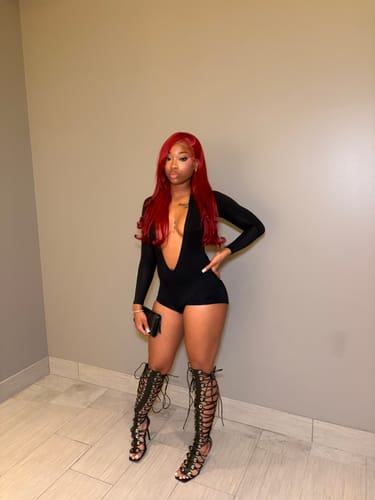 Customer's black Nadia Short bodysuit with long sleeves, worn with lace-up gladiator heels.