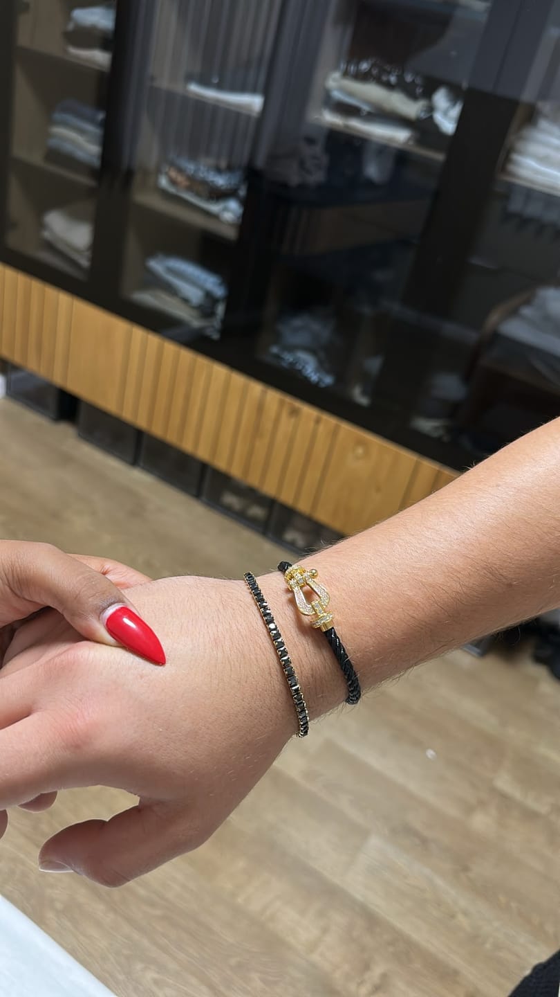 Customer photo review of צמיד יוקרתי עם רצועת חבל שחורה ואבזם בגוון גולד משובץ זירקונים נוצצים — JEWELLUXE™