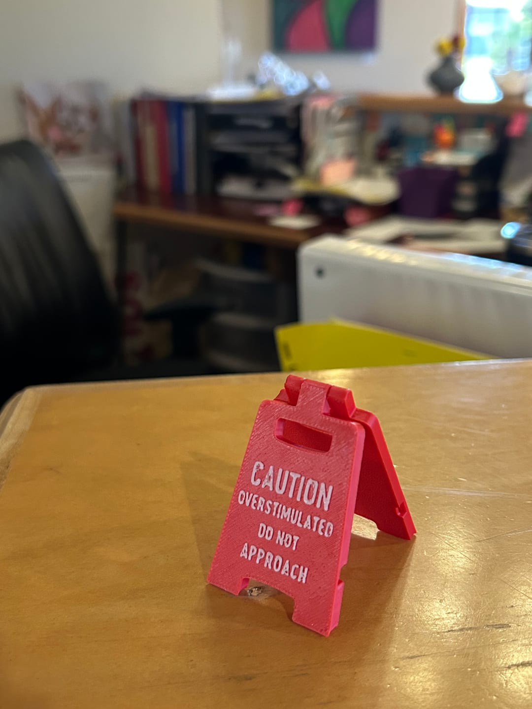 Customer photo review of Caution Overstimulated Do Not Approach (Red Mini Desk Sign)