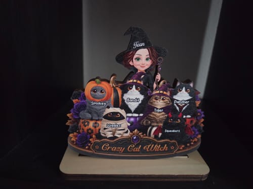 Customer's personalized Crazy Cat Witch wooden plaque with a witch figure and six cats on a display base.