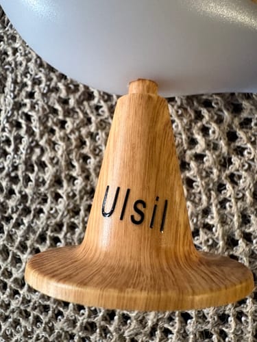 Customer's Glow Bird light with a wooden-textured base featuring the word Ulsil printed on it.