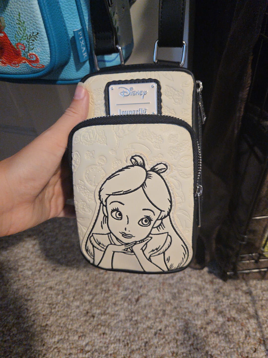 Customer photo review of Loungefly Disney Alice in Wonderland Cell Phone Sling Crossbody Bag with Coin Bag