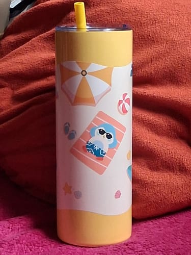 Customer's yellow water bottle with a pattern featuring a small bird character on a beach with an umbrella and ball.