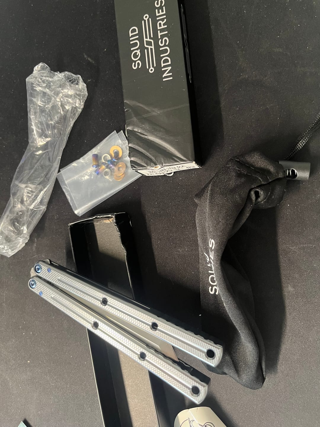 Customer photo review of Blue River Glossy Kraken 7075 Aluminum Handle Titanium Alloy Screws Balisong Stainless Steel Blade Clone Bushing