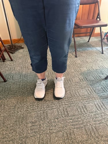 Customer's CUURT Muuv wide toe box court shoes in a light color being worn by a person.