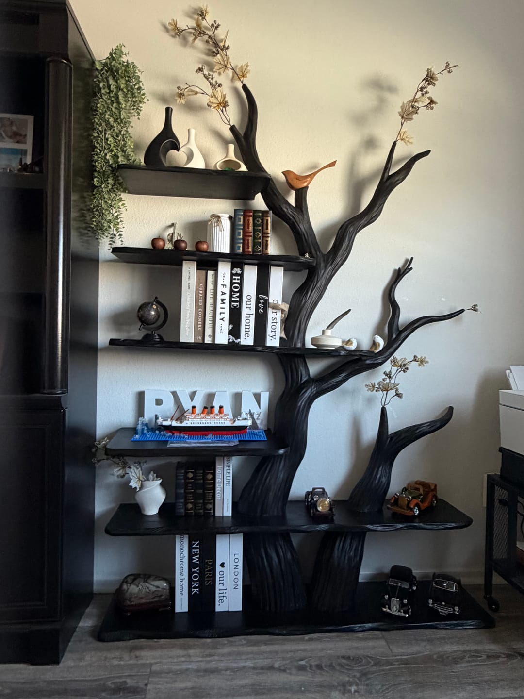 Customer photo review of Sculptural Tree Branch Live Edge Solid Wood Wall Shelf – Dramatic Black Organic Bookshelf