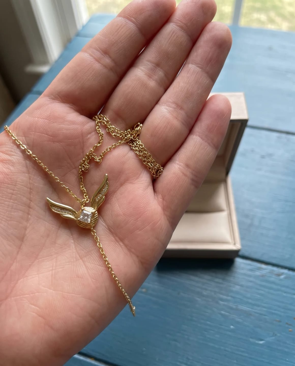 Customer photo review of Premium Golden Snitch Necklace