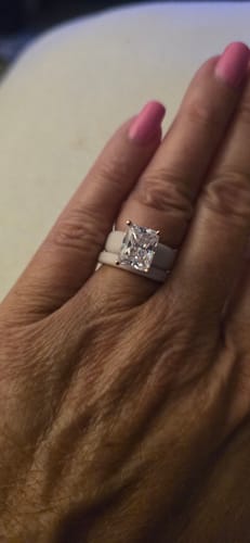 Customer's Emerald Cut CZ Silicone Ring Set worn on a finger, showing the radiant stone and flexible band.