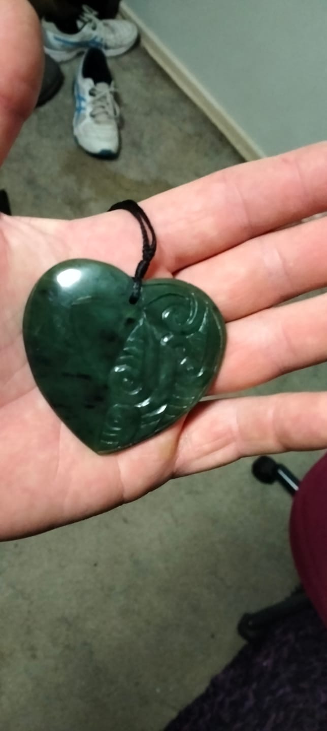 Customer photo review of Genuine NZ Greenstone Heart Necklace with Carved Detail – Pounamu Pendant