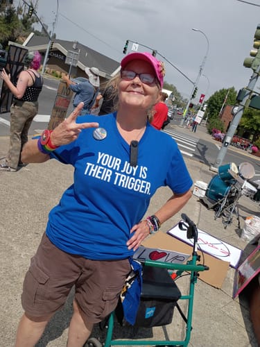 Customer photo review of Your Joy is their Trigger Unisex Tee