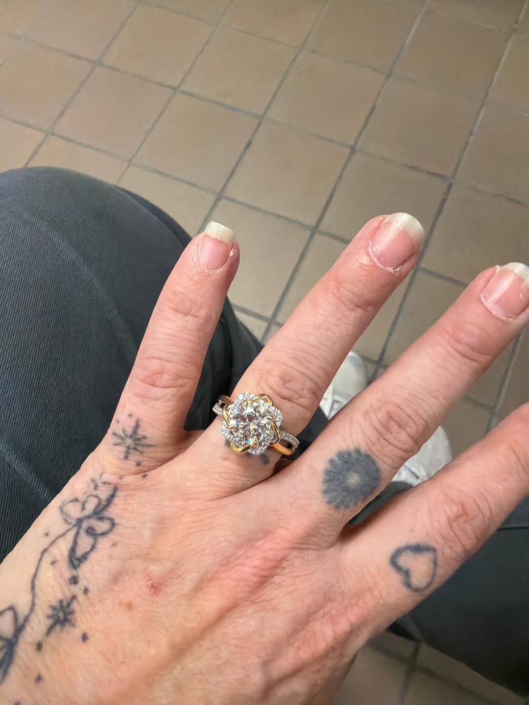 Customer photo review of Two-Tone Eternal Love Knot Round Moissanite Twisted Engagement Ring