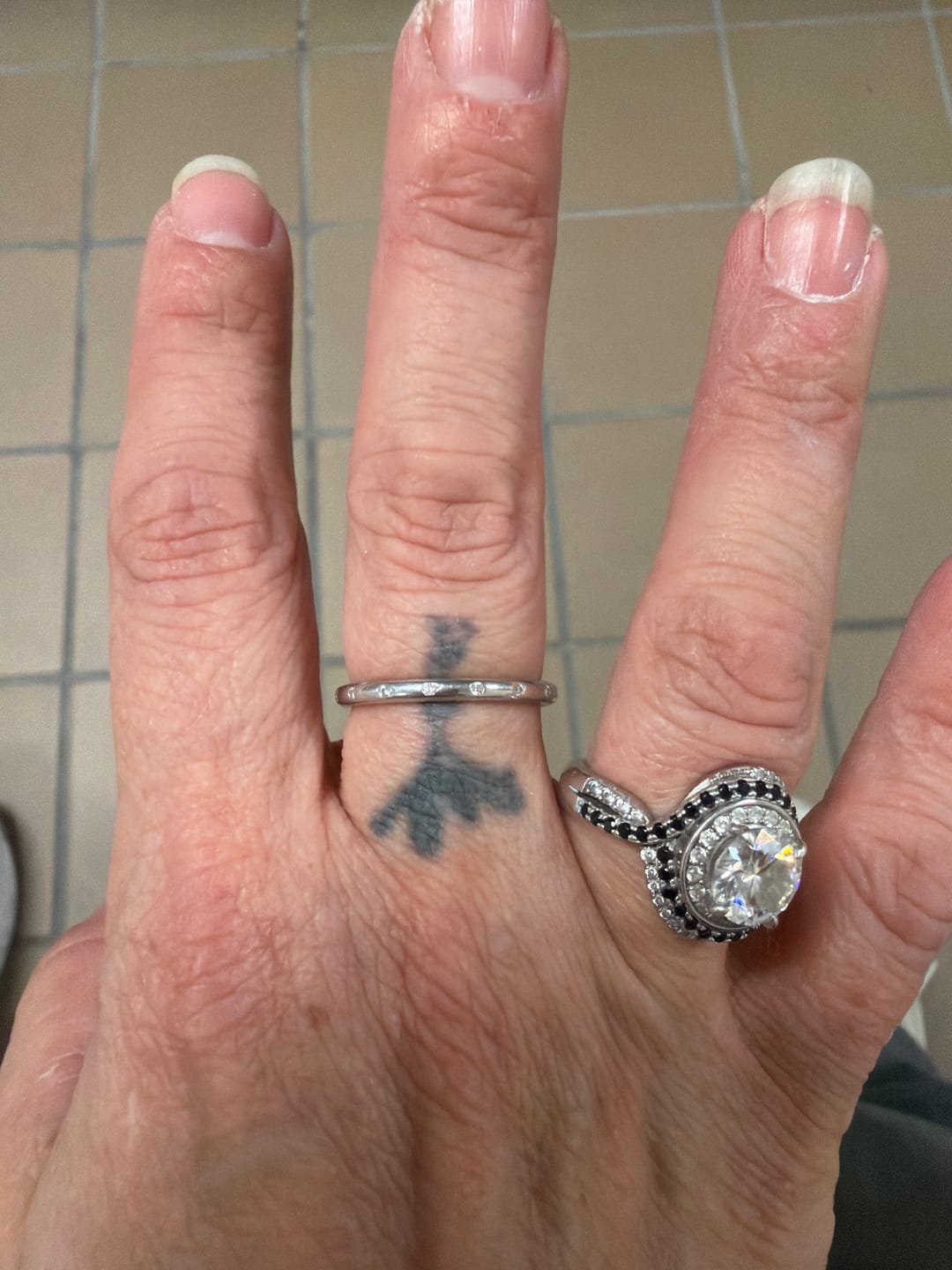 Customer photo review of Flush Set Moissanite Evenly Spaced Eternity Wedding Band
