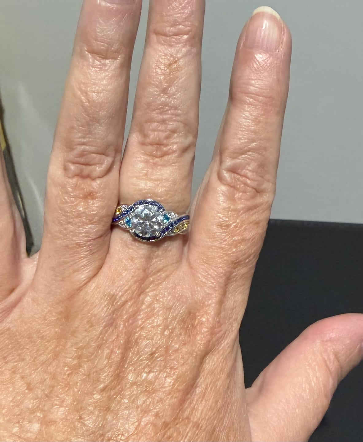 Customer photo review of Starry Night Moissanite Artistic Swirl Accent Engagement Ring