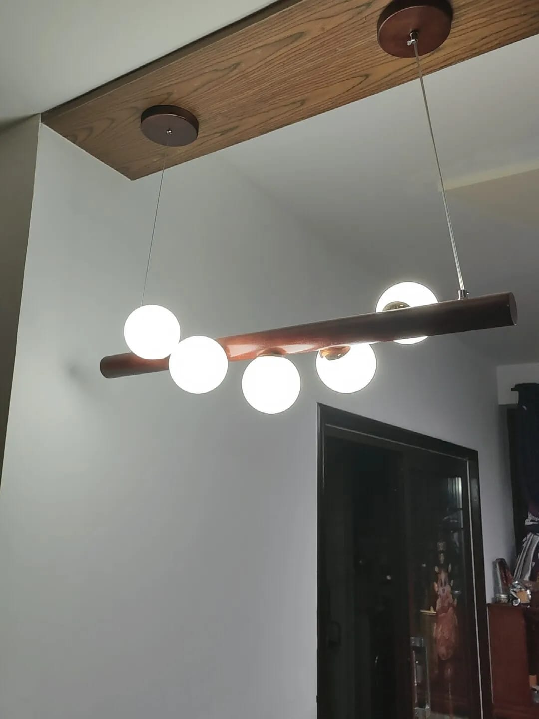 Customer photo review of Linear Wood Pendant Light, Walnut Bar, Opal Glass Globes, G9