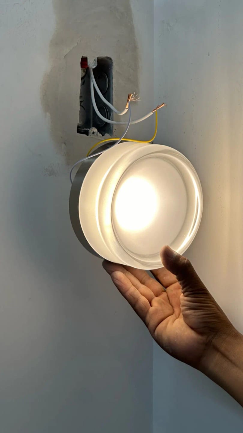 Customer photo review of Round Glass Wall Sconce With Aluminum Body And Glass Shade Single Light