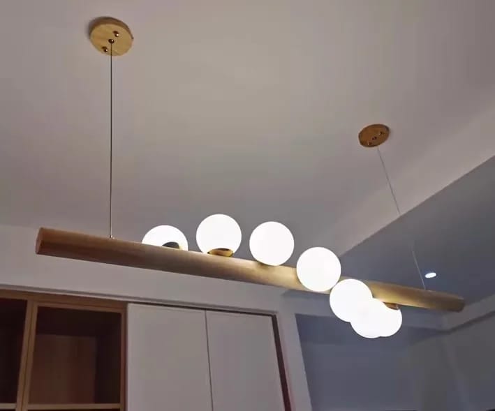 Customer photo review of Linear Wood Pendant Light, Walnut Bar, Opal Glass Globes, G9