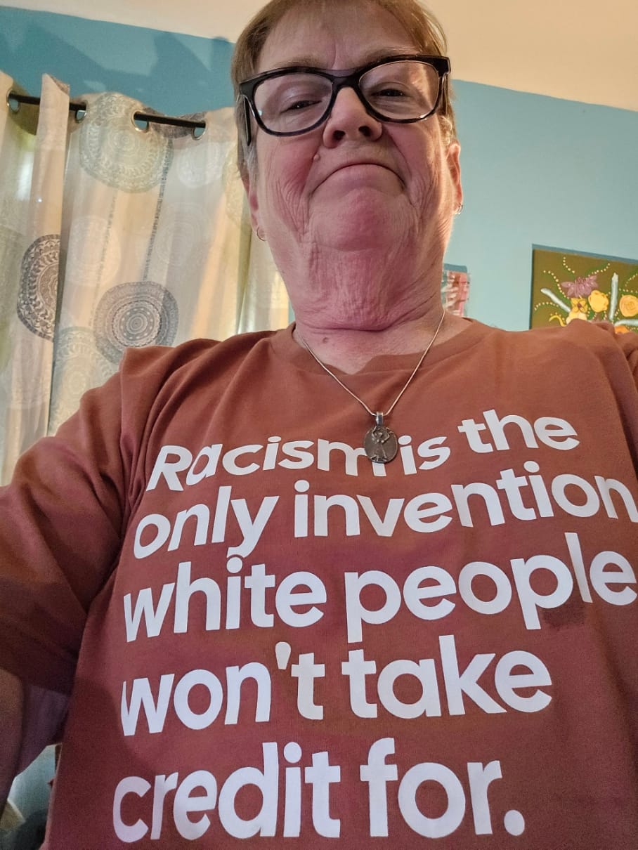 Customer photo review of Racism Is the Only Invention White People Won’t Take Credit For Unisex Tee