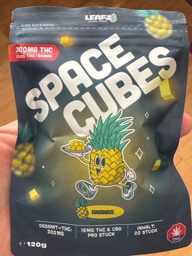 Customer's pack of THC Space Cubes, front view showing pineapple character and product details.