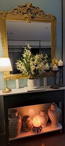 Customer's Michel French Provincial candle holders on a sideboard display, adding elegant light to the room.