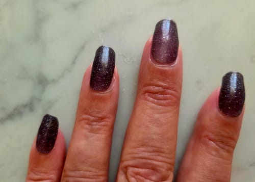 Customer's Blush Nightfall UV Gel Nail Wraps showing a shimmering black to pink gradient on fingernails.