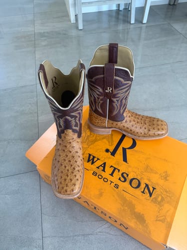 Customer's R. Watson exotic boots with textured vamps and leather shafts sitting on their product box.