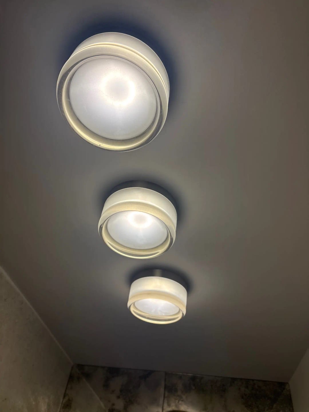 Customer photo review of Round Glass Wall Sconce With Aluminum Body And Glass Shade Single Light