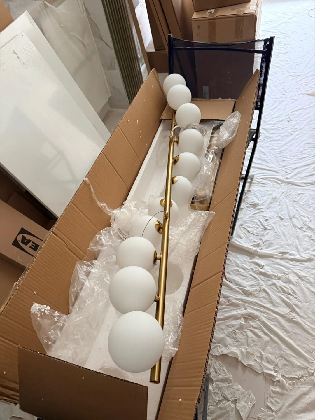 Customer photo review of Linear Wood Pendant Light, Walnut Bar, Opal Glass Globes, G9