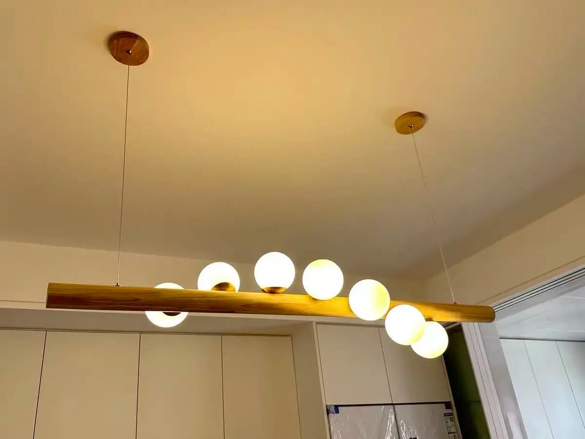 Customer photo review of Linear Wood Pendant Light, Walnut Bar, Opal Glass Globes, G9