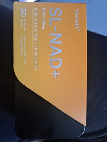 Reviewer's SL-NAD+ supplement box in orange and black packaging, showing product details.