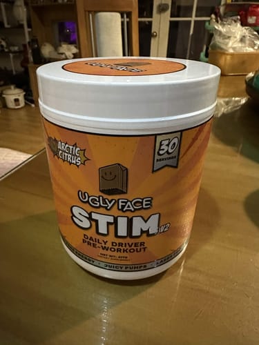 Customer's UGLYFACE STIM V2 Arctic Citrus pre-workout tub sitting on a kitchen table.