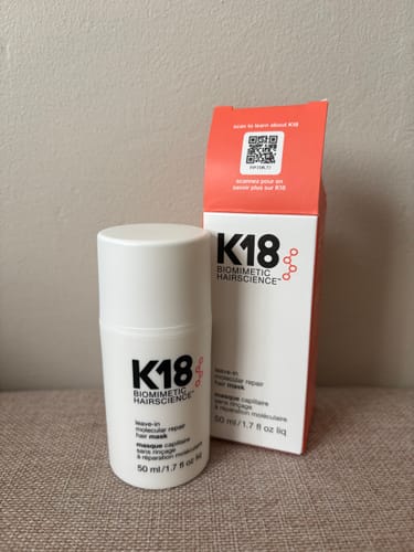 Customer's K18 Leave In Molecular Hair Repair Mask bottle and white-and-orange product box sitting on a surface.