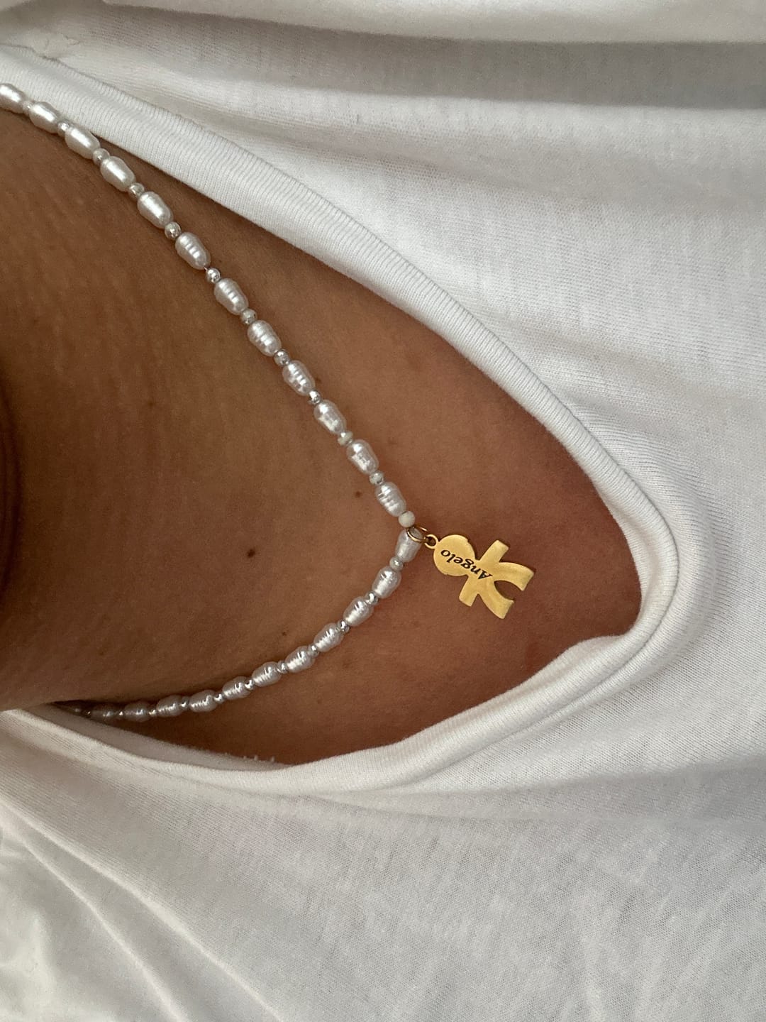 Customer photo review of Girocollo perline con bambini e incisione