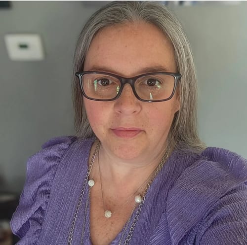 Reviewer's portrait showcasing vibrant hair after using the probiotic-infused Shampoo.