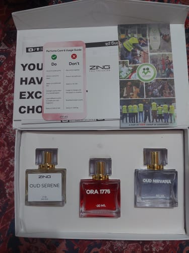 Customer's OUD Supreme BUNDLE box containing three perfume bottles and a usage guide card.