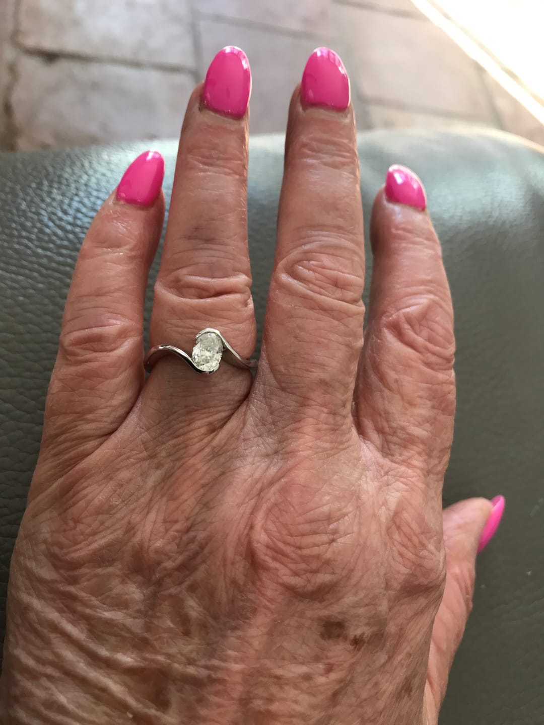 Customer photo review of Minimalist Half-Bezel Solitaire Bypass Oval Cut Moissanite Engagement Ring