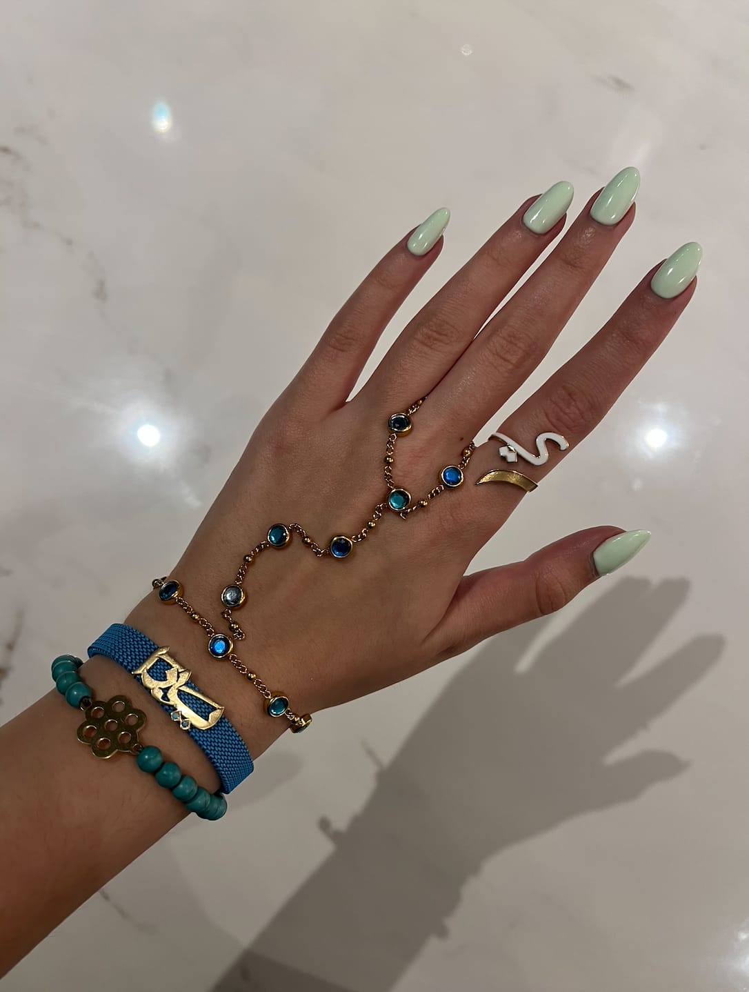 Customer photo review of Tshenolo Gold Green Hand Chain