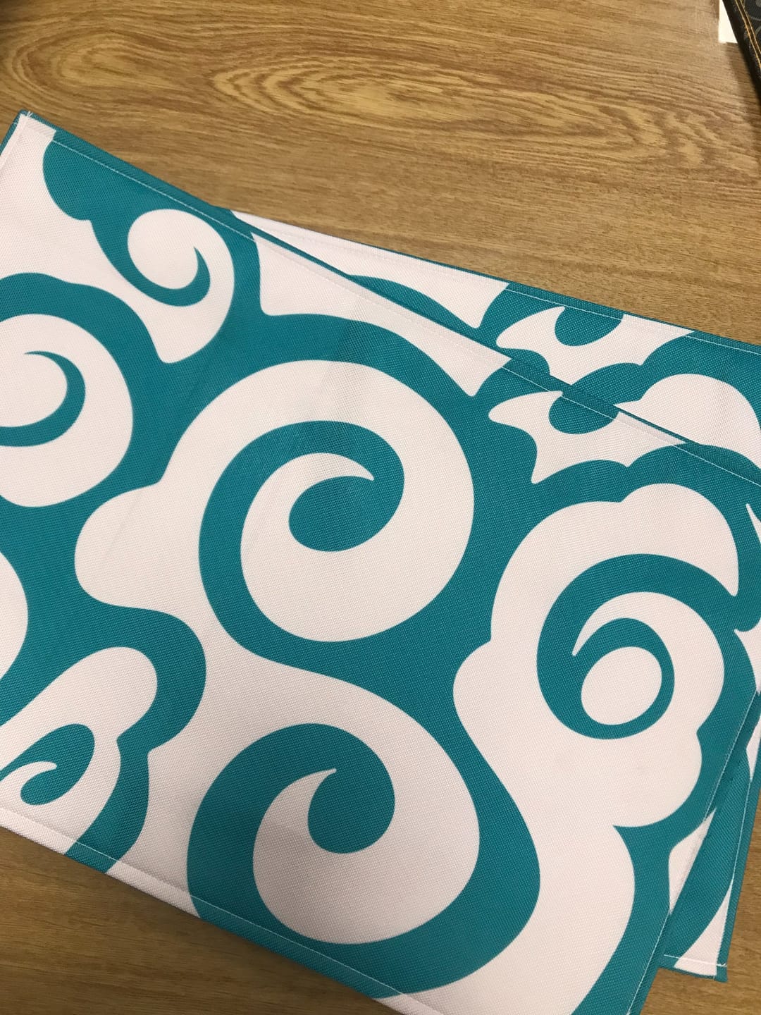 Customer photo review of Teal Swirl – Canvas Table Mat
