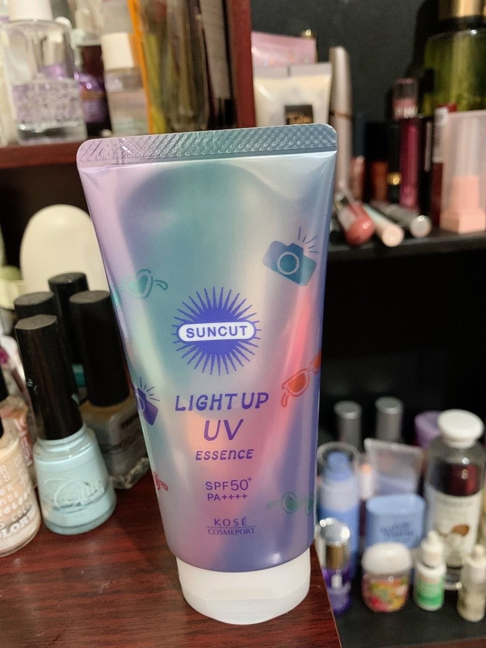 Customer photo review of Kose Suncut Light Up UV Essence SPF50+ 80g