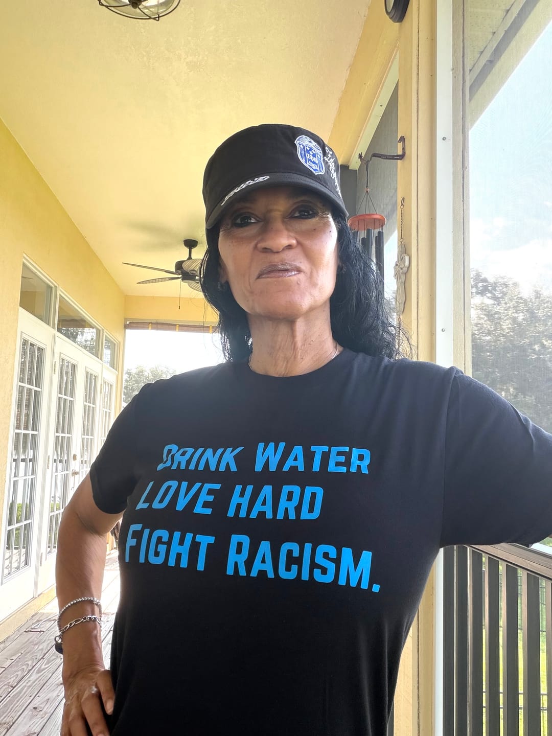 Customer photo review of Drink Water Fight Racism Unisex T-shirt