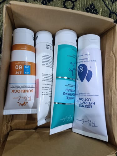 Customer's 24 Hour Glow Pack skincare set, four tubes inside a cardboard shipping box.
