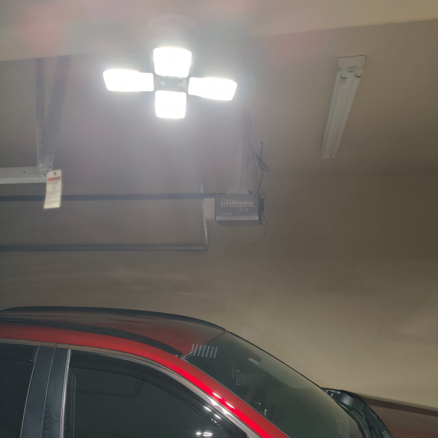 Customer photo review of LED Motion Sensing Garage Light 140-Watt 15,000 Lumen, Adjustable 4-Panel LED Light, 5000K Daylight, E26