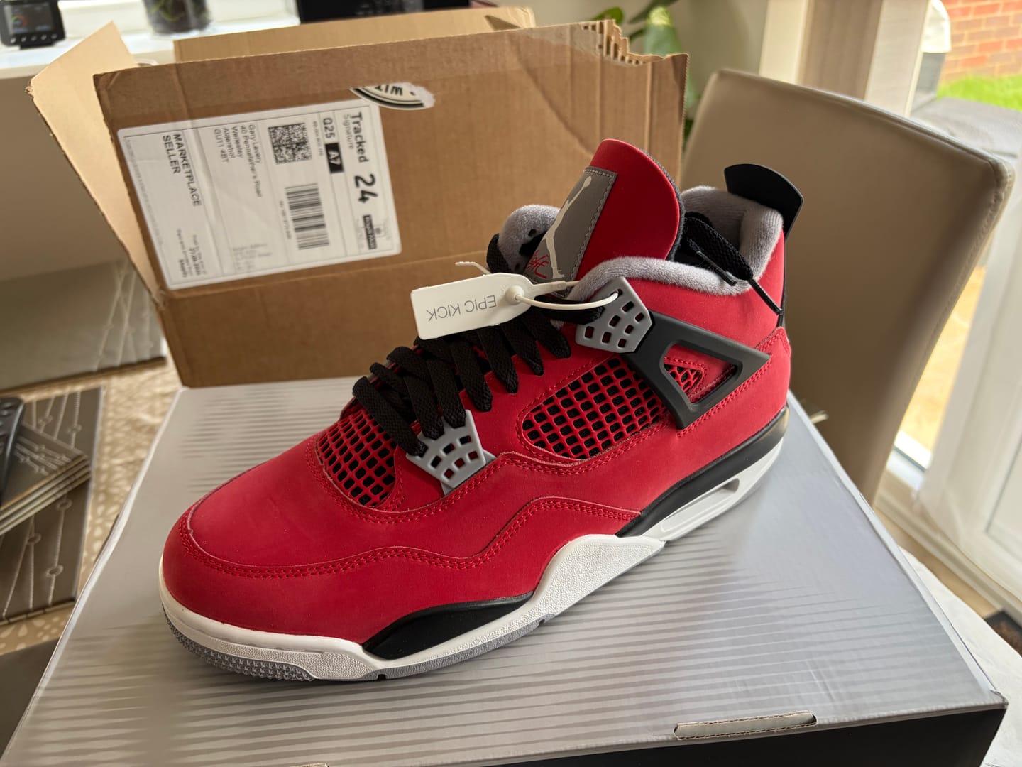 Customer photo review of Air Jordan 4 Retro 'Toro Bravo'