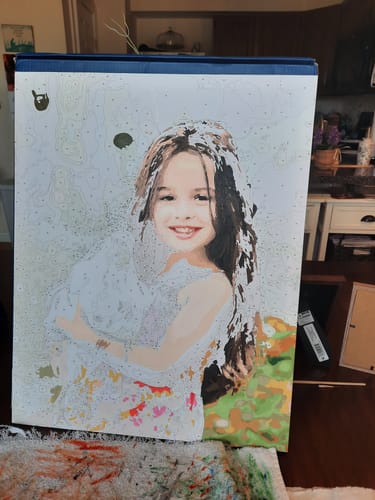 Customer's Number Remover Marker paint-by-number portrait of a girl holding a chicken, in progress.